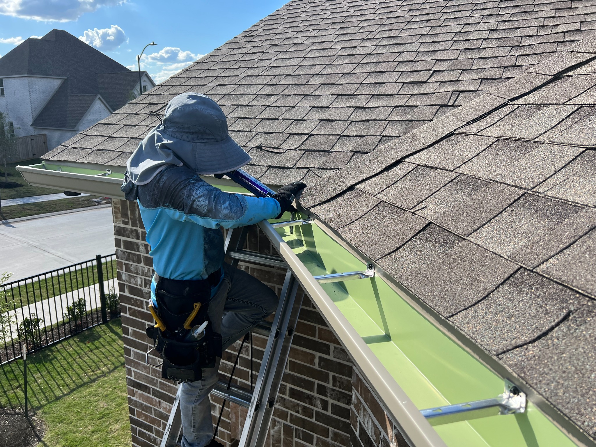 Seamless gutter installation on a Cypress Texas home